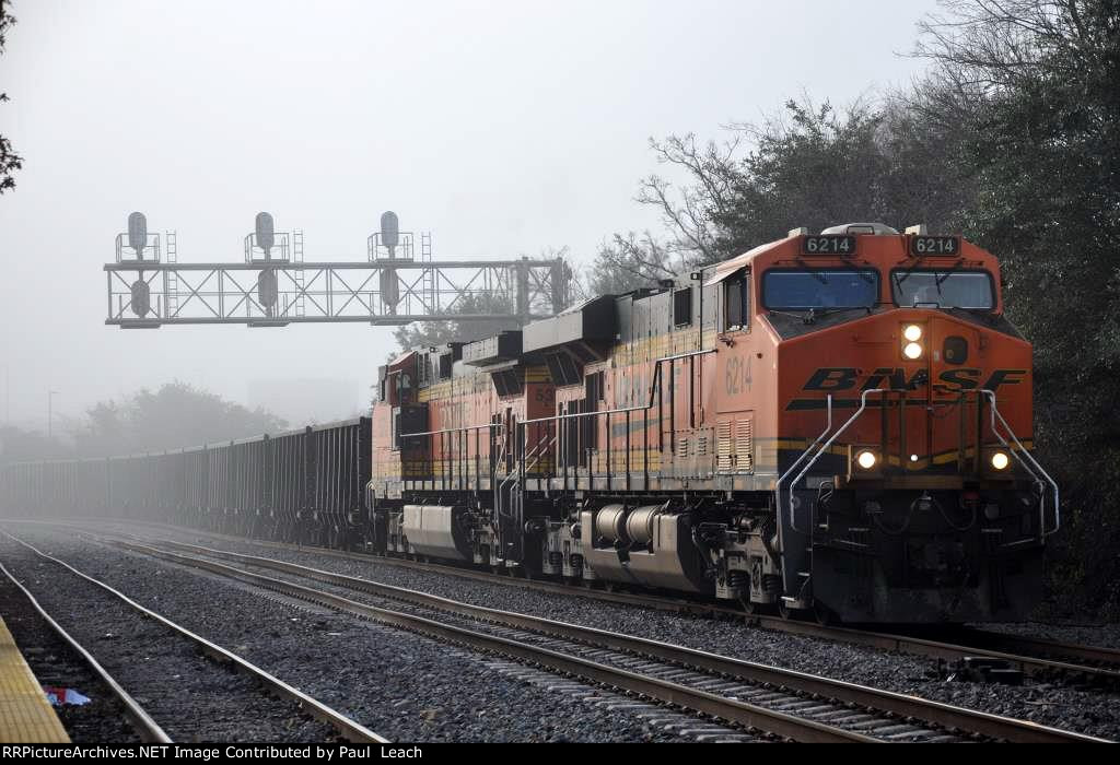 Ballast train rolls west through the station